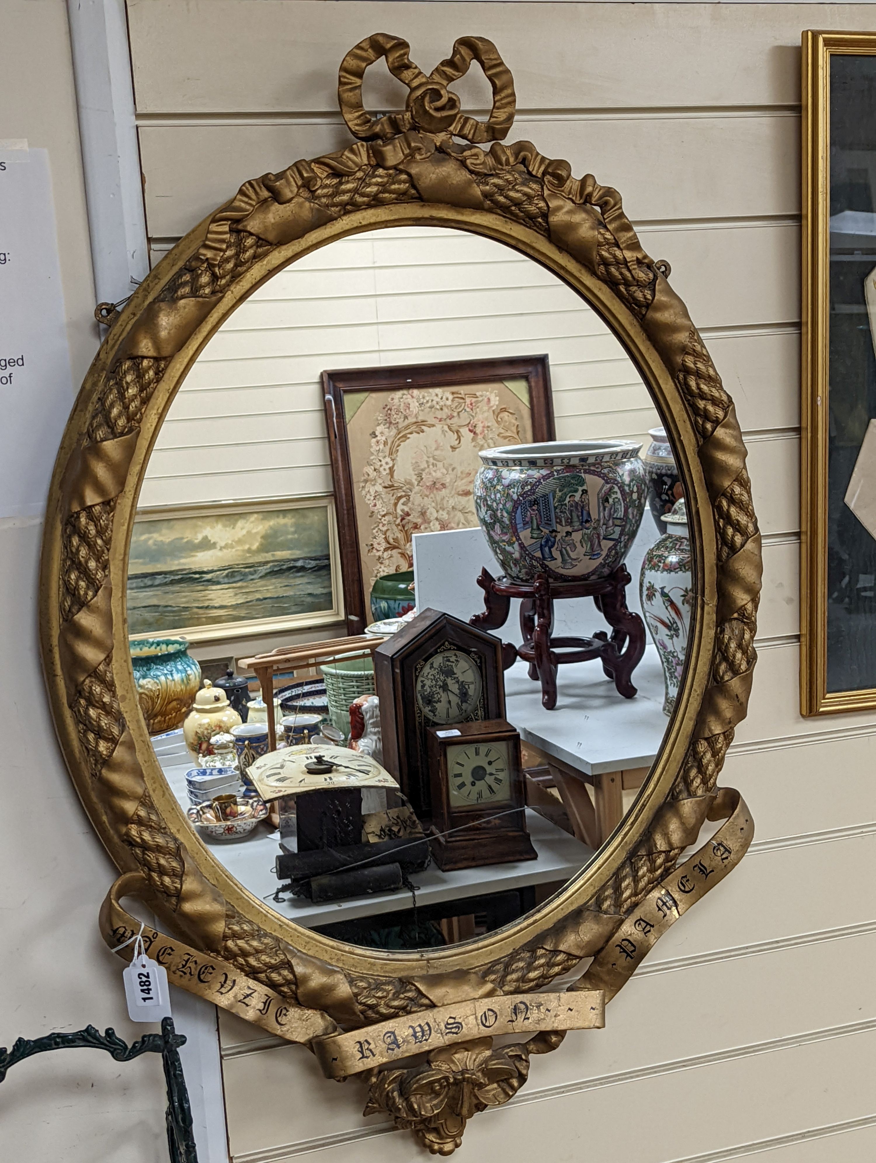 A Victorian gilt and composite mirror,, 99 cms high.